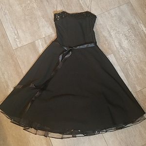 Strapless black dress with sequin band